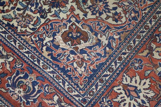 An Isphahan red and cream medallion rug 240 x 140cm